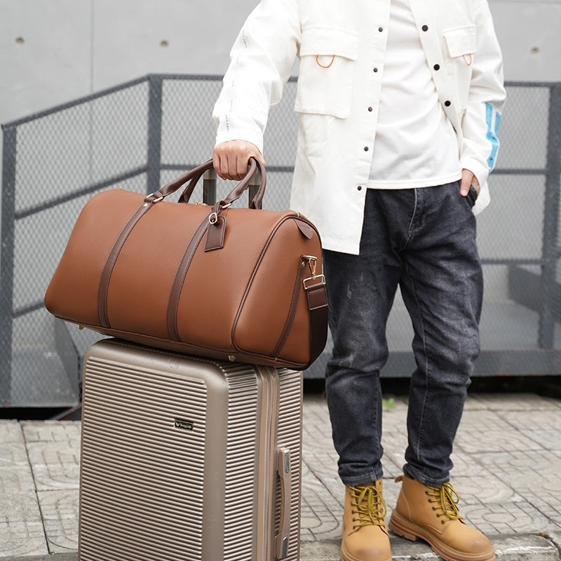 THE MICA LEATHER DUFFLE BAG - MANSLANE